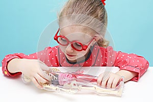 Little girl explore the structure of human body.