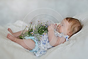 Little girl explores flowers