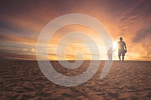 Little girl and father walking on sand