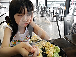 Little Girl Feels Lack of appetite with Food