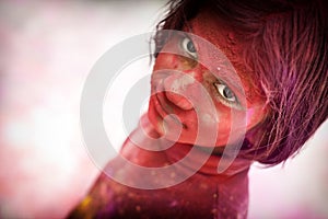 Little girl during the festival of colors in India - `HOLI`