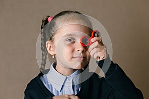 Little girl with Fidget Spinner held up to his eyes