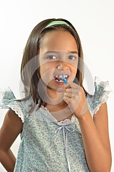 Little Girl Flossing her Teeth