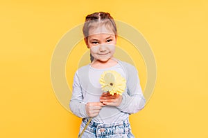 Little girl with flower