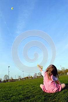 Little girl flying kite