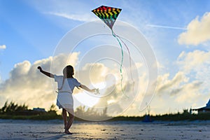 Little girl flying a kite