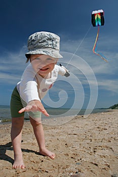 Little girl flying kite