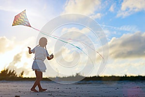 Little girl flying a kite