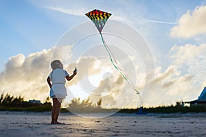 Little girl flying a kite