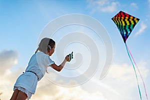 Little girl flying a kite