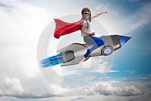 The little girl flying rocket in superhero concept