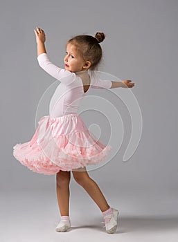 The little girl of four years is engaged in dancing