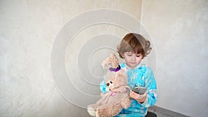 Little girl with friend listening music on phone.