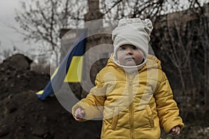 Little girl in front of defensive structures.