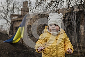 Little girl in front of defensive structures.