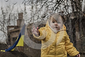 Little girl in front of defensive structures.