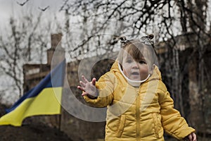 Little girl in front of defensive structures.