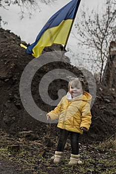 Little girl in front of defensive structures.