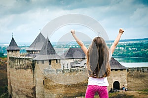 Little girl in front of Khotyn Fortress photo