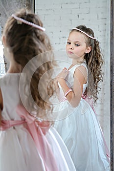 Little girl front the mirror