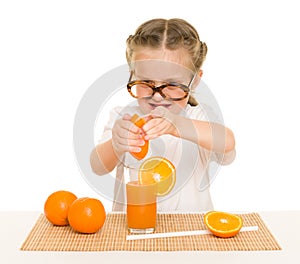 Little girl with fruits and vegetables make juice