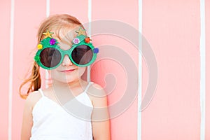 Little girl in funny Christmas glasses