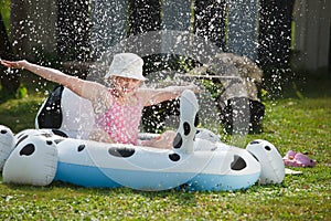 Little girl in garden pool