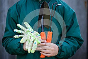 Little Girl Gardener With Garden Tools Close-Up.