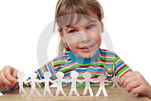 Little girl with garland of paper creatures