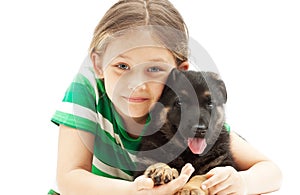 little girl and a German Shepherd puppy on white b