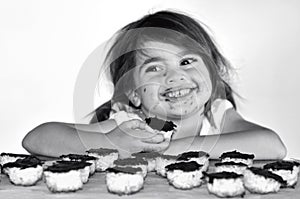 Little girl getting caught eating chocolate cookies