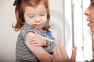 Little girl getting a flu shot photo