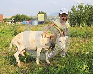 Little girl with goat.