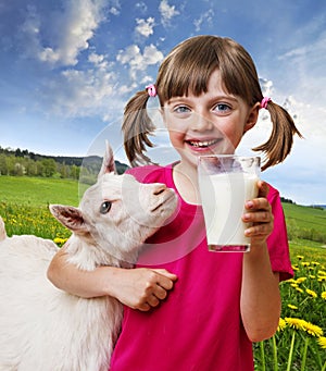 Little girl with a goat