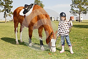 Little girl goes horse riding