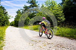 Little girl going in bicycle