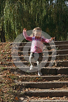 Little girl going down the steps