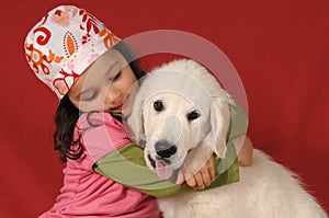 Little girl with a Golden retriever