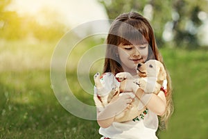 Little girl with a Golden retriever puppy