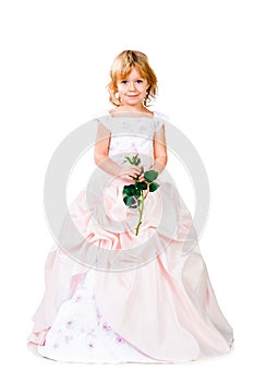 Little girl in gorgeous dress over white