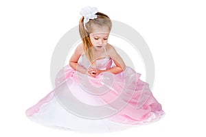 Little girl in gorgeous gown isolated on white