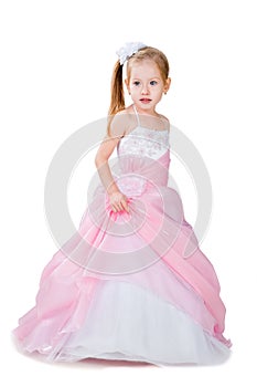 Little girl in gorgeous gown isolated on white