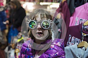 Little girl with a Gothic sunglasses with diffracted lens