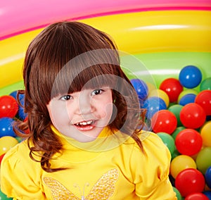 Little girl with group ball.