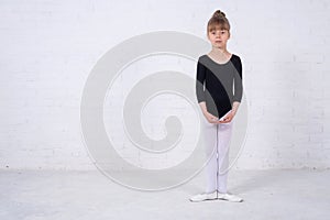 Little girl in the gymnastic swimsuit, free space