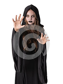 Little girl in Halloween witch costume