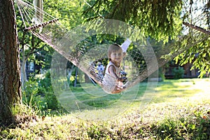 Little girl in hammock nature summer