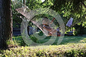 Little girl in hammock nature summer