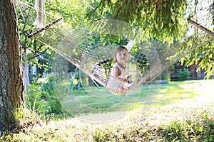 Little girl in hammock nature summer