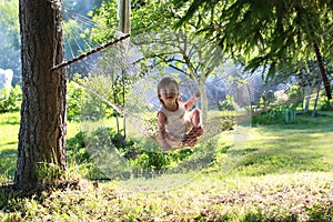 Little girl in hammock nature summer